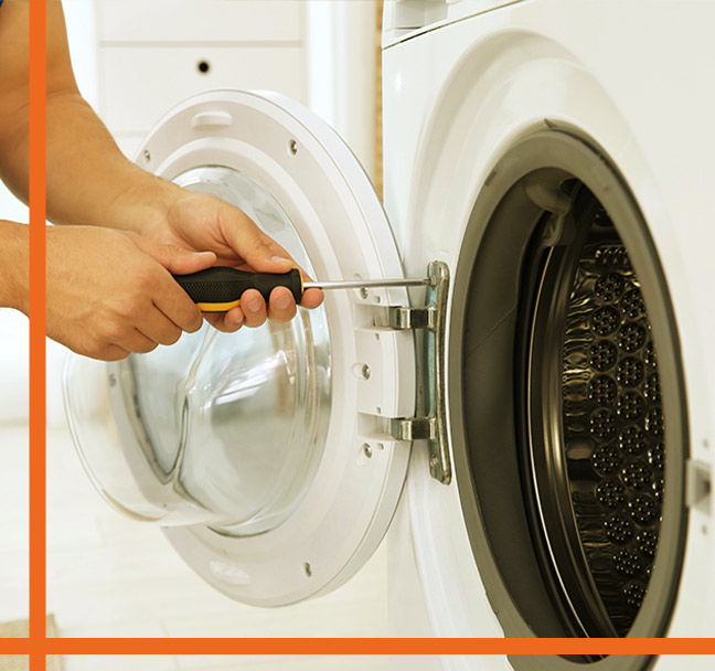 close-up-of-a-technician-using-a-screwdriver-to-install-dryer-fort-collins-co