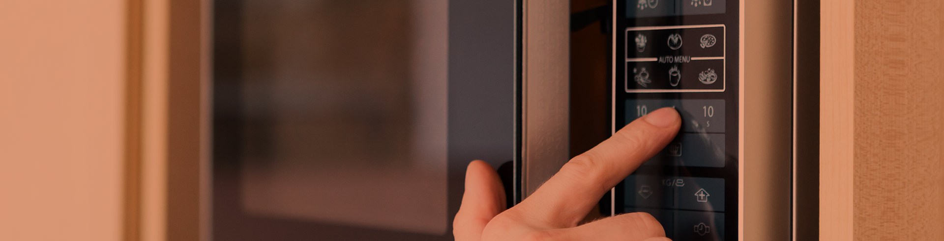close-up-of-a-womans-hand-using-the-microwaves-keyboard-fort-collins-co