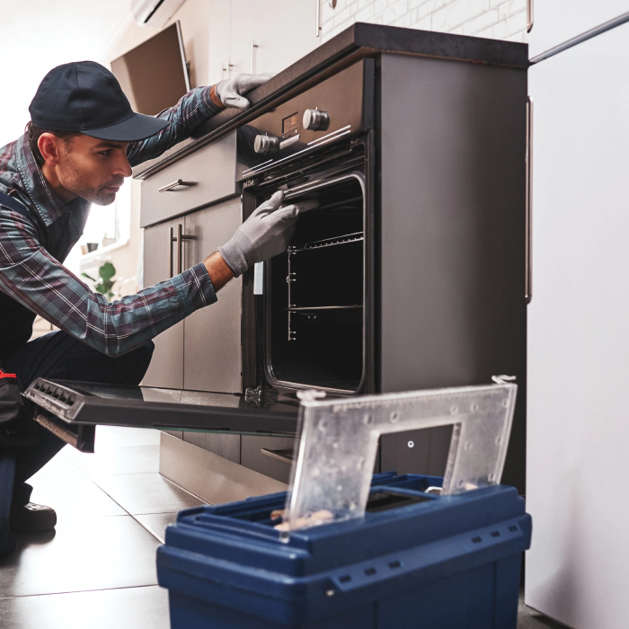 technician checking an oven wellington co